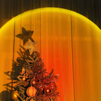 Sunset glow behind a Christmas tree