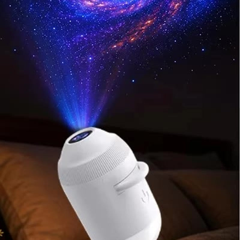 Galaxy projection above a bed